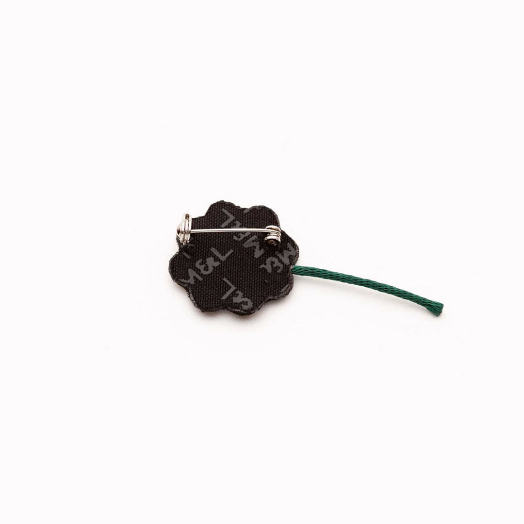 Hand-embroidered 4 Chances lapel pin by Parisian fashion accessory brand Macon et Lesquoy. Measuring approximately 25mm by 25mm, the Light Heart is part of their 'Rock like an Egyptian' Collection.
