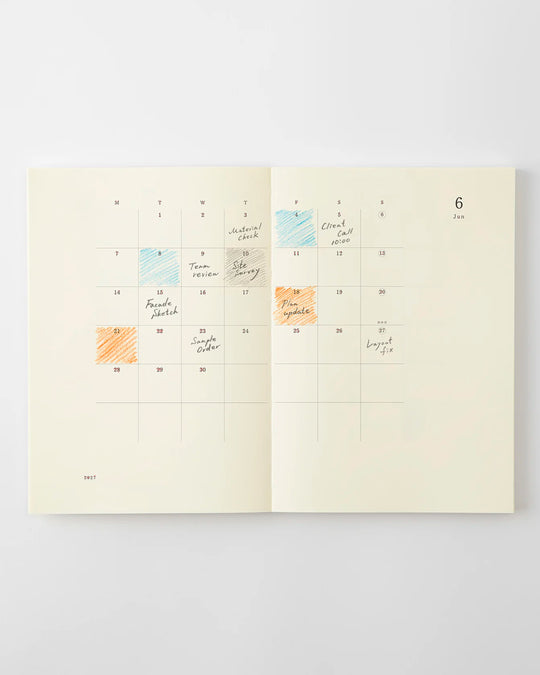 The diary includes block type monthly schedule pages and pages divided into eight sections across a two-page spread for use as a weekly schedule.