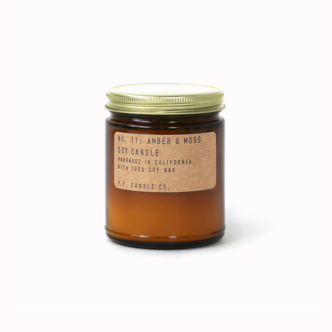 Amber and Moss scented candle forms part of the core collection from P.F. Candle Co. These classic fragranced candles are hand poured into apothecary inspired amber jars with signature kraft label and brass lid which give a warm, comforting glow and divine scent.