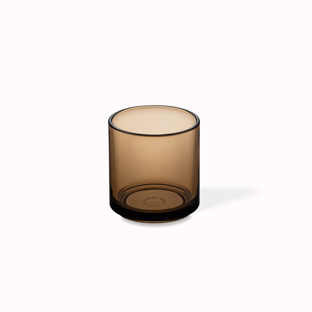 Amber glass tumbler by Hasami Porcelain is a stackable glass with clean lines and a minimalist feel.