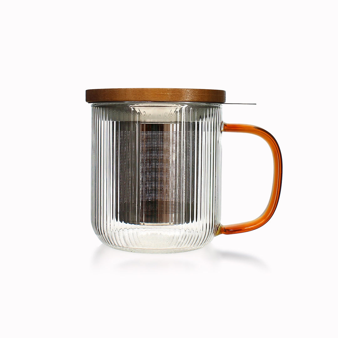 Tea for one in a borosilicate glass teapot mug with graphite grey handle, by French brand Ogo Living. Topped with a wooden lid to keep your tea warm while it brews.