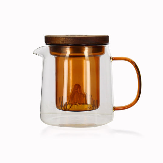 Elegant and contemporary glass teapot made from borosilicate glass with amber coloured glass strainer and handle