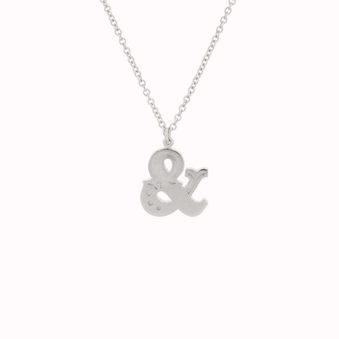 The Ampersand pendant necklace captures details and flourishes inspired by the traditional handpainted signage of yesteryear. As with all Alex Monroe creations, it is handmade in the UK.