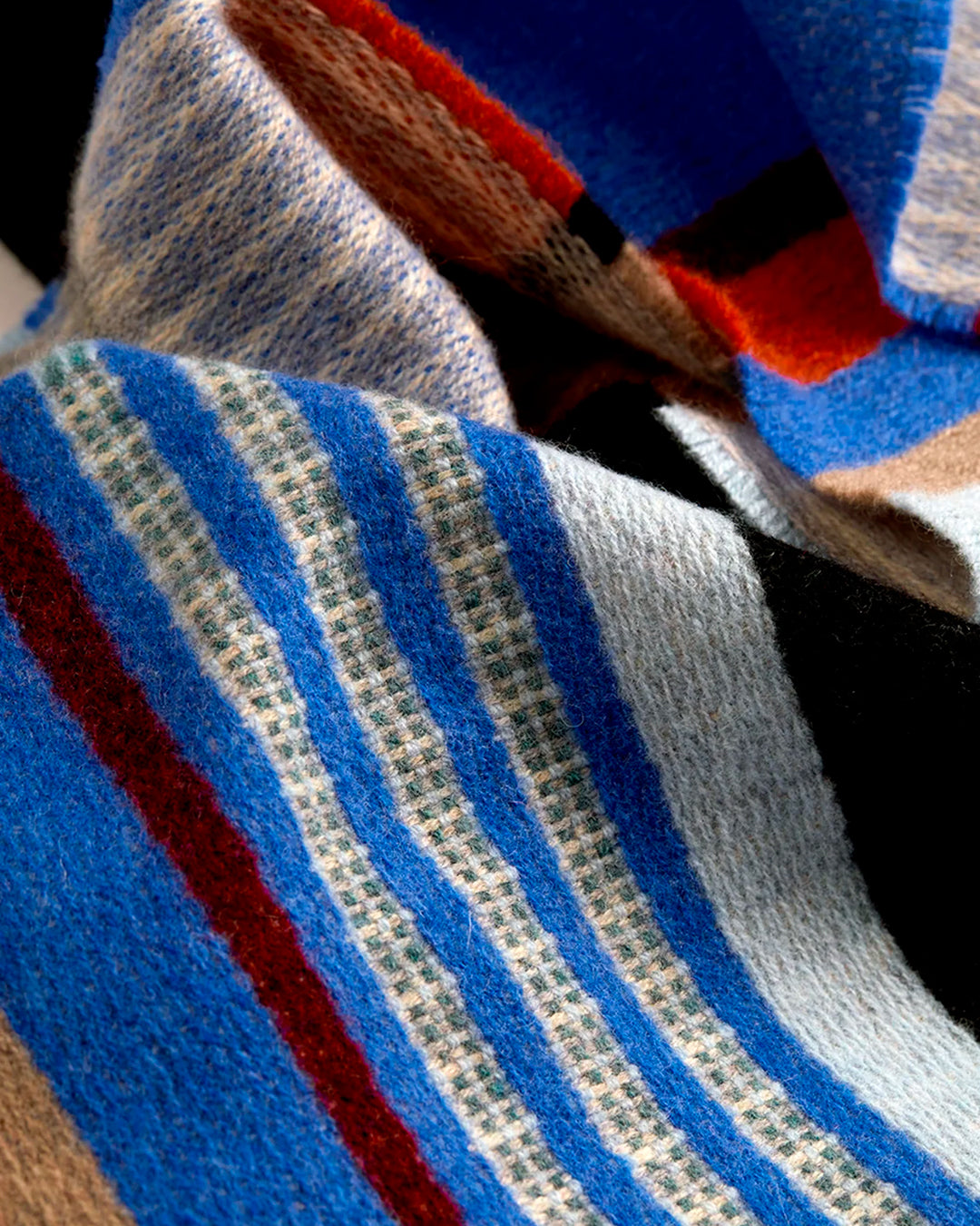Angus is a classic Wallace Sewell stripe where dynamic, bold bands of colour meet finer stripes, and delicate hopsack details peek through, creating an interplay of scale and texture.