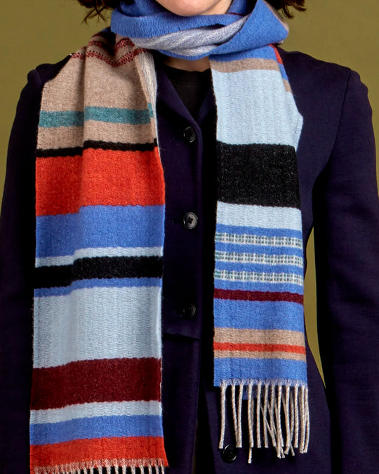 Angus is a classic Wallace Sewell stripe where dynamic, bold bands of colour meet finer stripes, and delicate hopsack details peek through, creating an interplay of scale and texture.