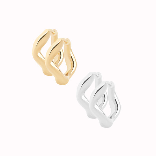 Anil from Maria Black is a wavy and versatile huggie earring. Wear it alone or stack it with different sizes up the ear.