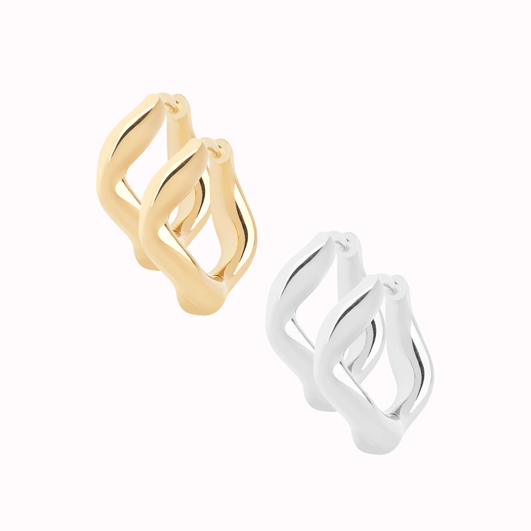 Anil 8mm pair from Maria Black is a wavy and versatile huggie earring. Wear it alone or stack it with different sizes up the ear.
