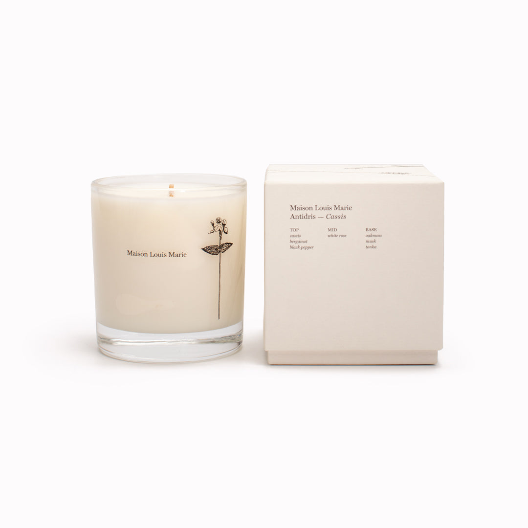 Antidris Cassis Candle with Box. Cassis, White Rose and Bergamot are the standout notes with the fragrance having fruity Bergamot and Cassis, with a green White Rose and warm Oakmoss and Musk base. The scent is floral and is described by Maison Louis Marie as a more feminine scent.
