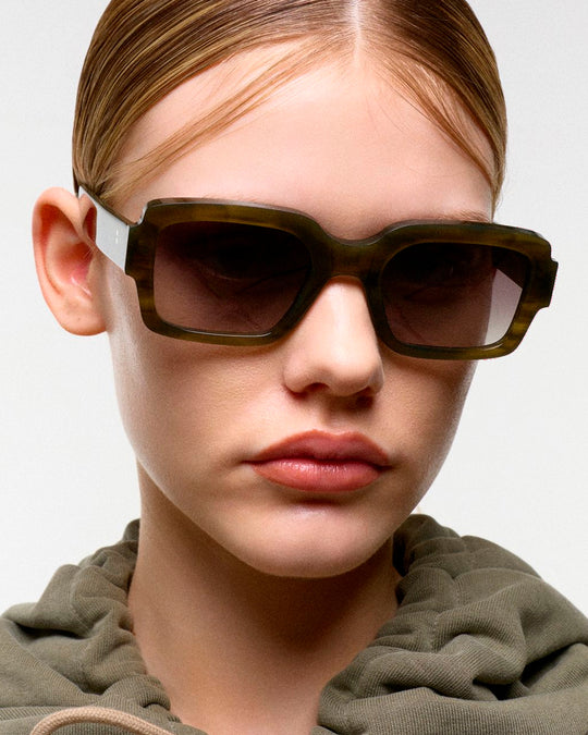 The sharp rectangular frames are crafted by hand from organic and biodegradable acetate, from&nbsp;Mazzucchelli while stainless steel hinges and coated screws ensure premium quality for lifelong wear.&nbsp;