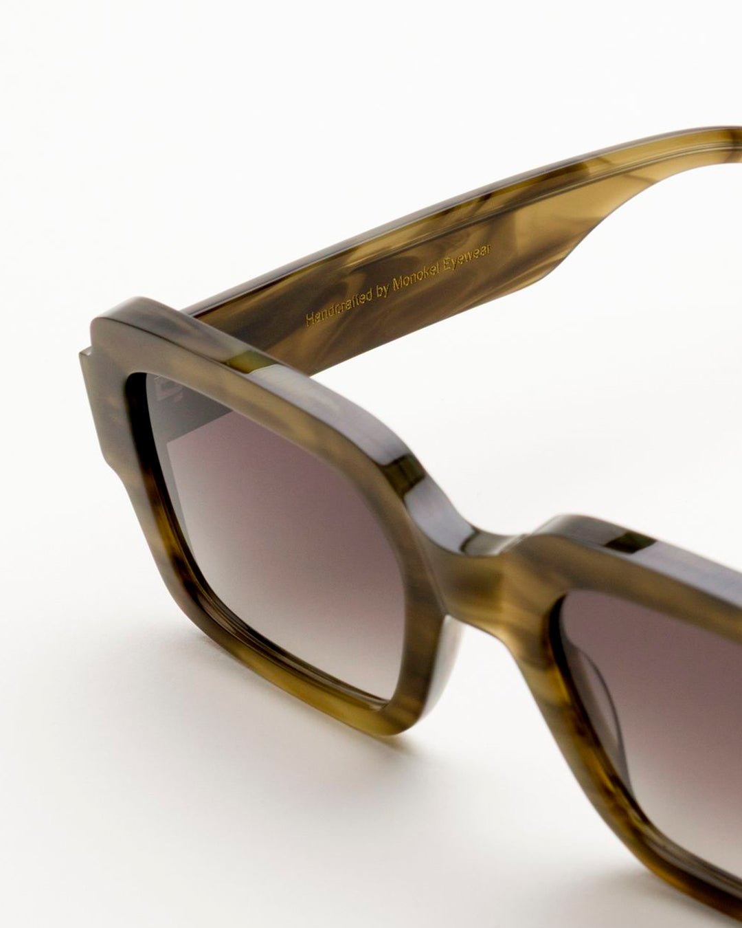 The sharp rectangular frames are crafted by hand from organic and biodegradable acetate, from&nbsp;Mazzucchelli while stainless steel hinges and coated screws ensure premium quality for lifelong wear.&nbsp;