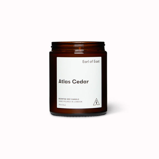 Atlas Cedar candle without lid by Earl of East is a premium scented candle that will fill your home with a warm and earthy aroma. This candle is inspired by the remote mountains of Marrakesh, where cedar wood, olive leaf and white musk create a unique and soothing blend.