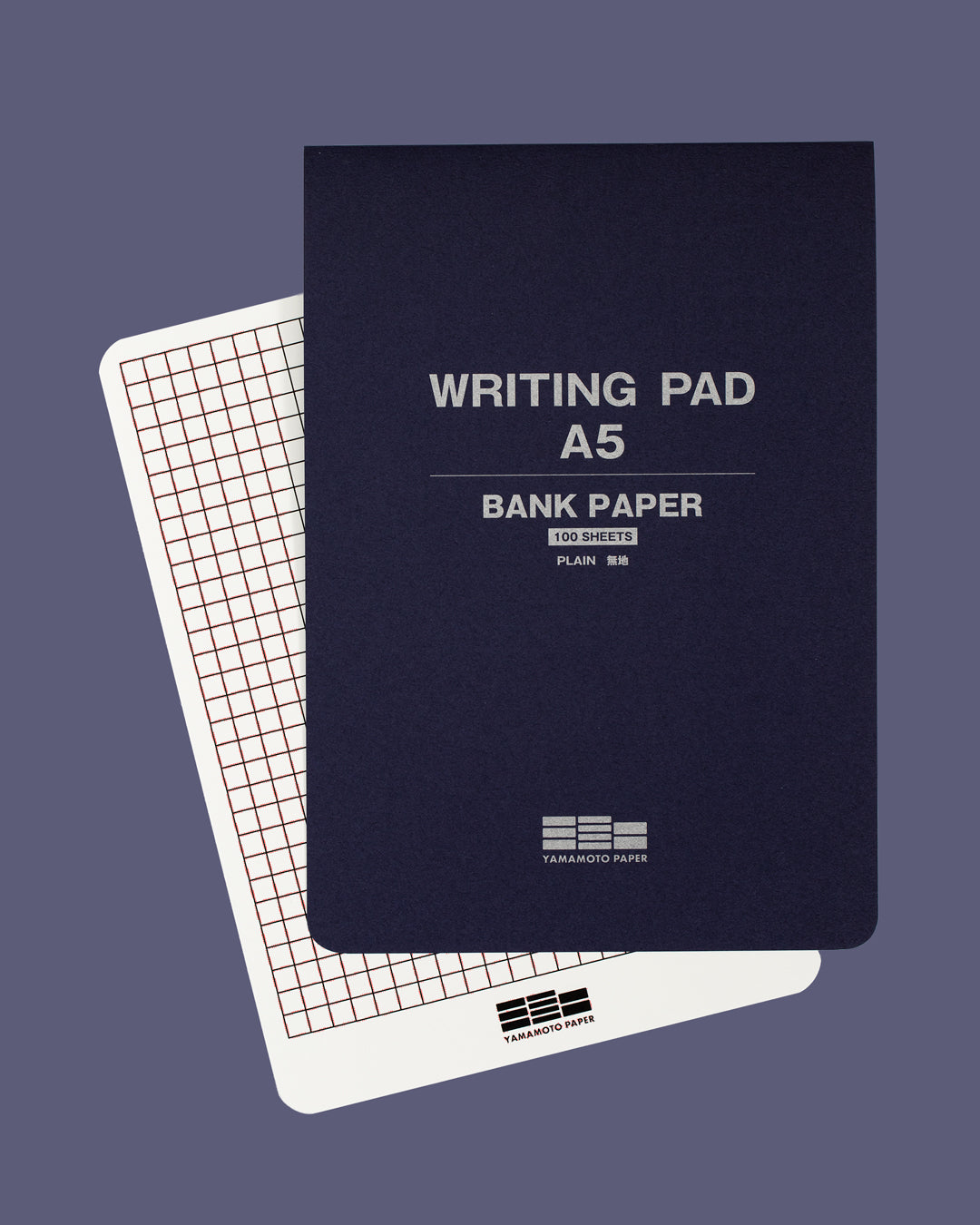 The pad is glue bound along the top edge for easy sheet removal, and the pad includes a removable guide sheet with grid layout on one side and ruled layout on the other.