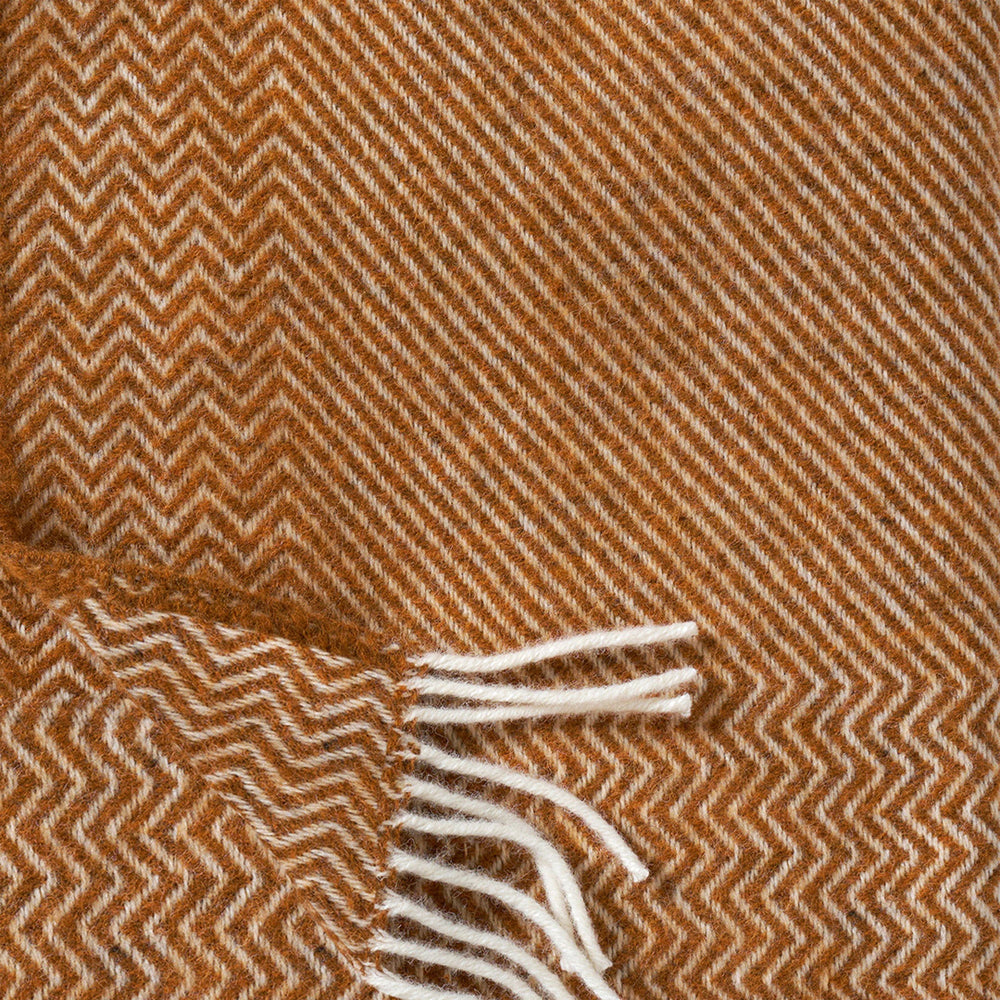 Cumin Detail - Bazaar is a premium and cosy Eco Lambswool throw in a rich cumin shade to suit neutral toned interiors. Perfect to snuggle up with on the sofa during the cold British Winter, or wrap it around yourself during cool evenings outdoors.