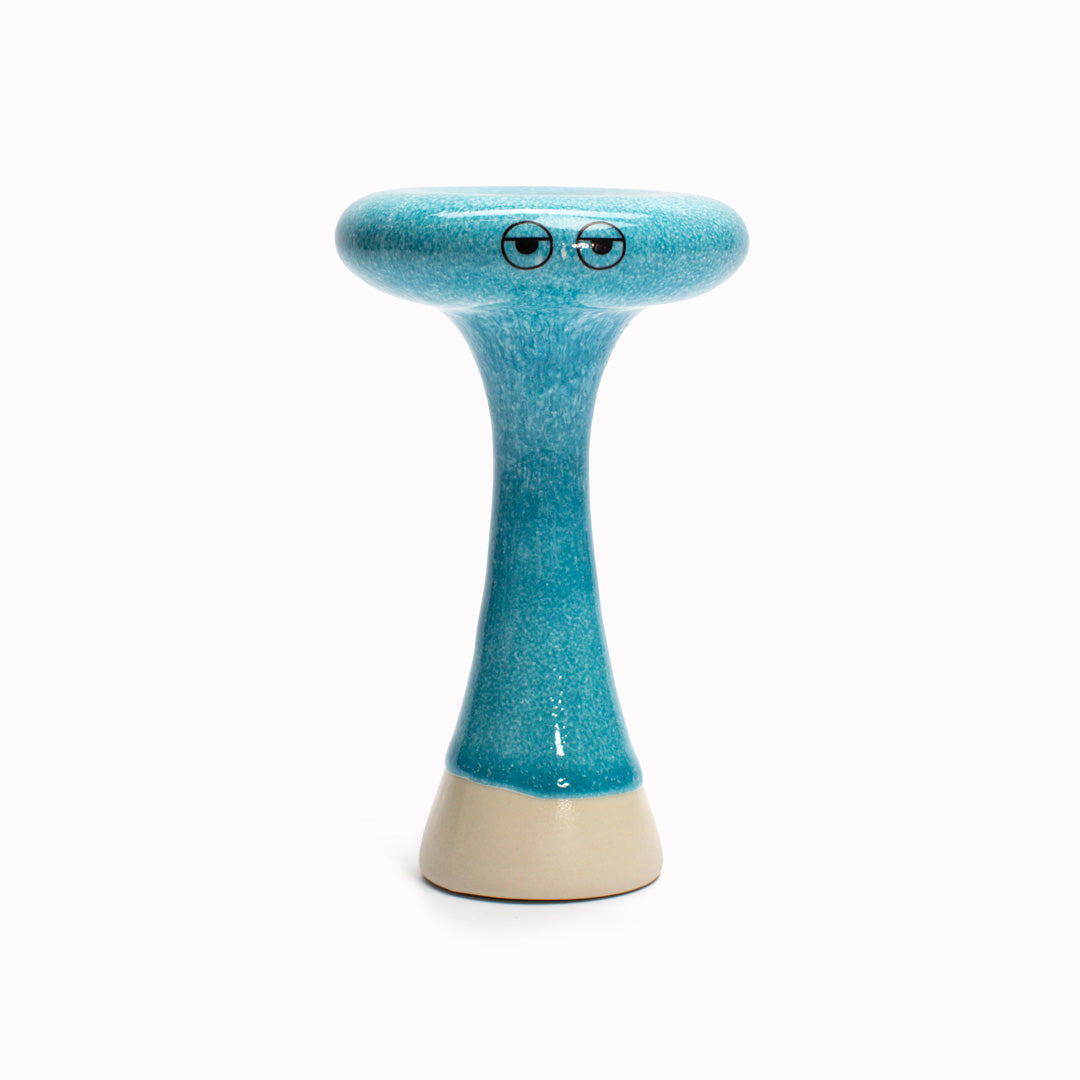 Azure Bern is a thin mushroom shaped, hand glazed ceramic figurine created as a close relative of the classic Arhoj Ghost. The Familia is a continuation of the playful decorative object series from Studio Arhoj.