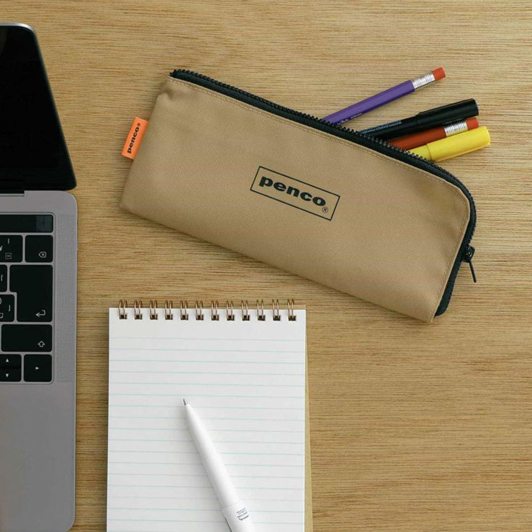 Neutral Beige coloured flat nylon pencil case with an 'L' zipper for easier access to internal contents. Storage for pens, pencils or even use for toiletries such as a toothbrush or make up brushes.&nbsp;