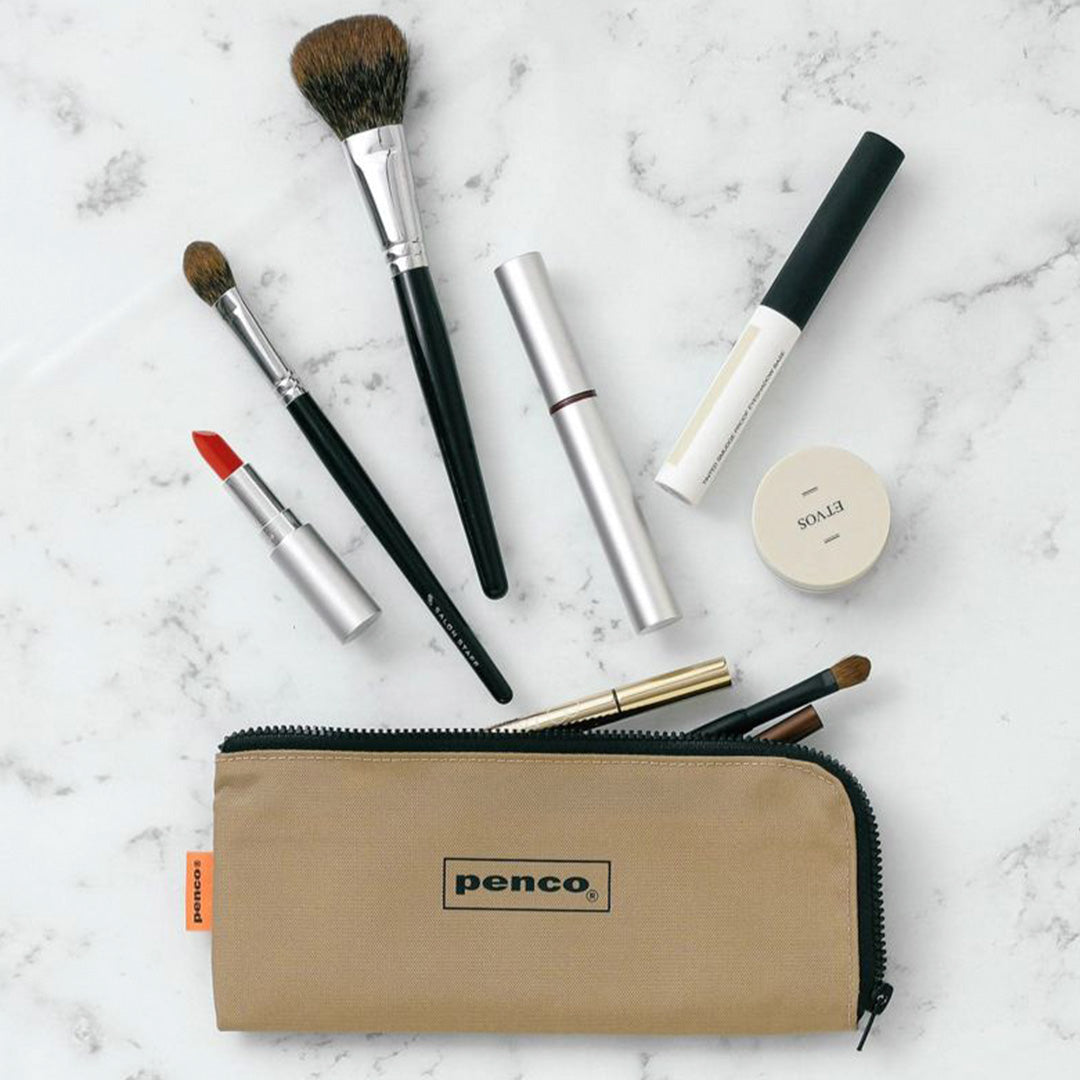 Neutral Beige coloured flat nylon pencil case with an 'L' zipper for easier access to internal contents. Storage for pens, pencils or even use for toiletries such as a toothbrush or make up brushes.&nbsp;