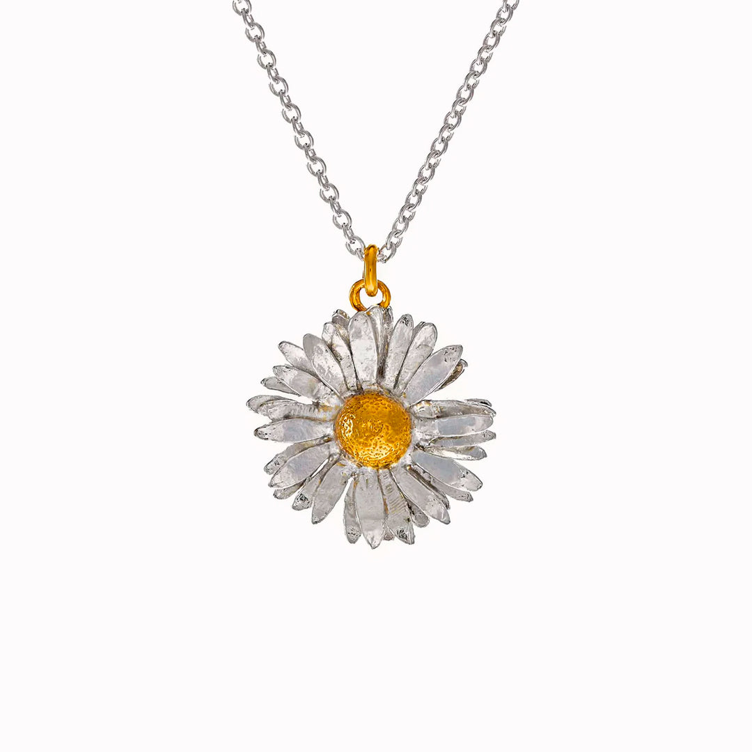 Inspired by nature, a replica daisy in a mix of recycled sterling silver and fairmined gold plate.