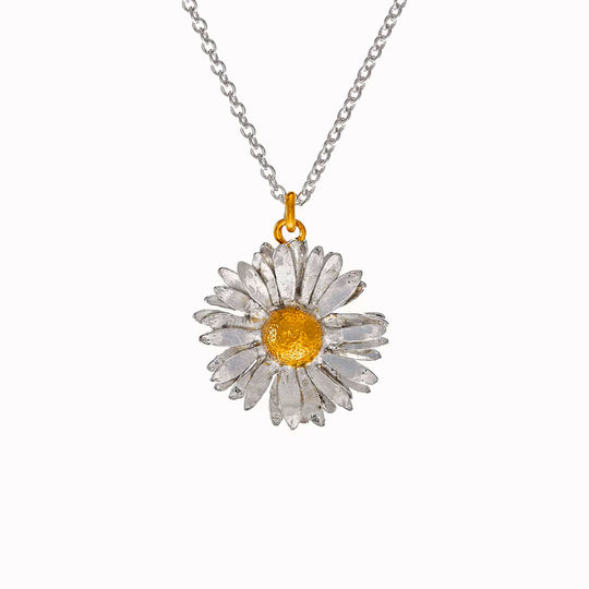 Inspired by nature, a replica daisy in a mix of recycled sterling silver and fairmined gold plate.