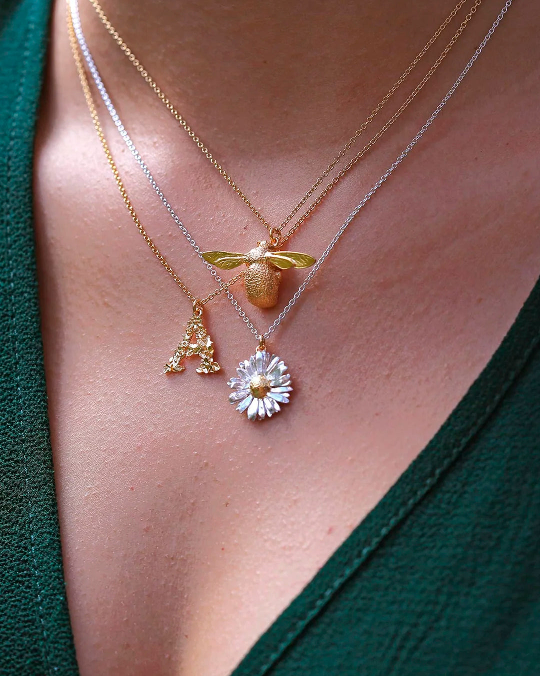 Inspired by nature, a replica daisy in a mix of recycled sterling silver and fairmined gold plate.