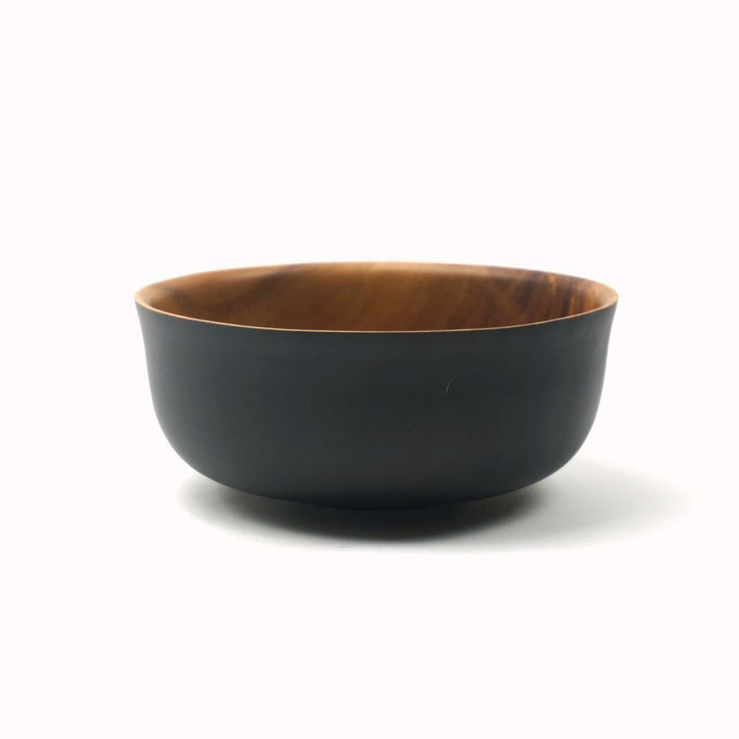 Japanese style Acacia wood serving bowl from Dutch company Kinta, who produce contemporary ceramics and homeware. Round in shape with tapered edge, the serving bowl is black on its exterior and natural acacia wood colour on the interior. It has a diameter of 22cm and is a great size for serving salads or other dishes shared at the table.