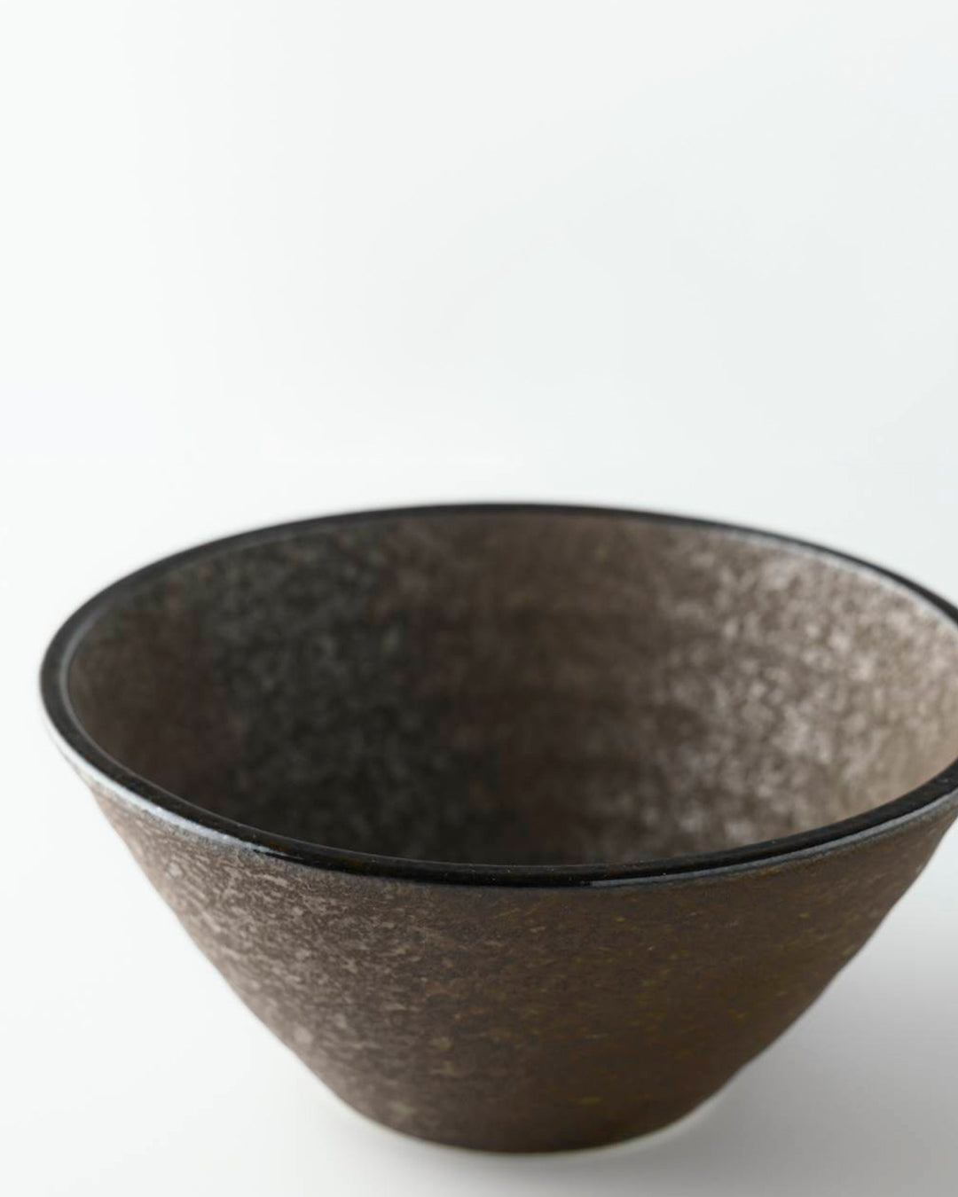 Rough textured Donburi bowl with matt glaze in a dark brown shade that catches the light to reveal a silvery shimmer. Suitable for serving individual rice portions, or any number of side dishes.