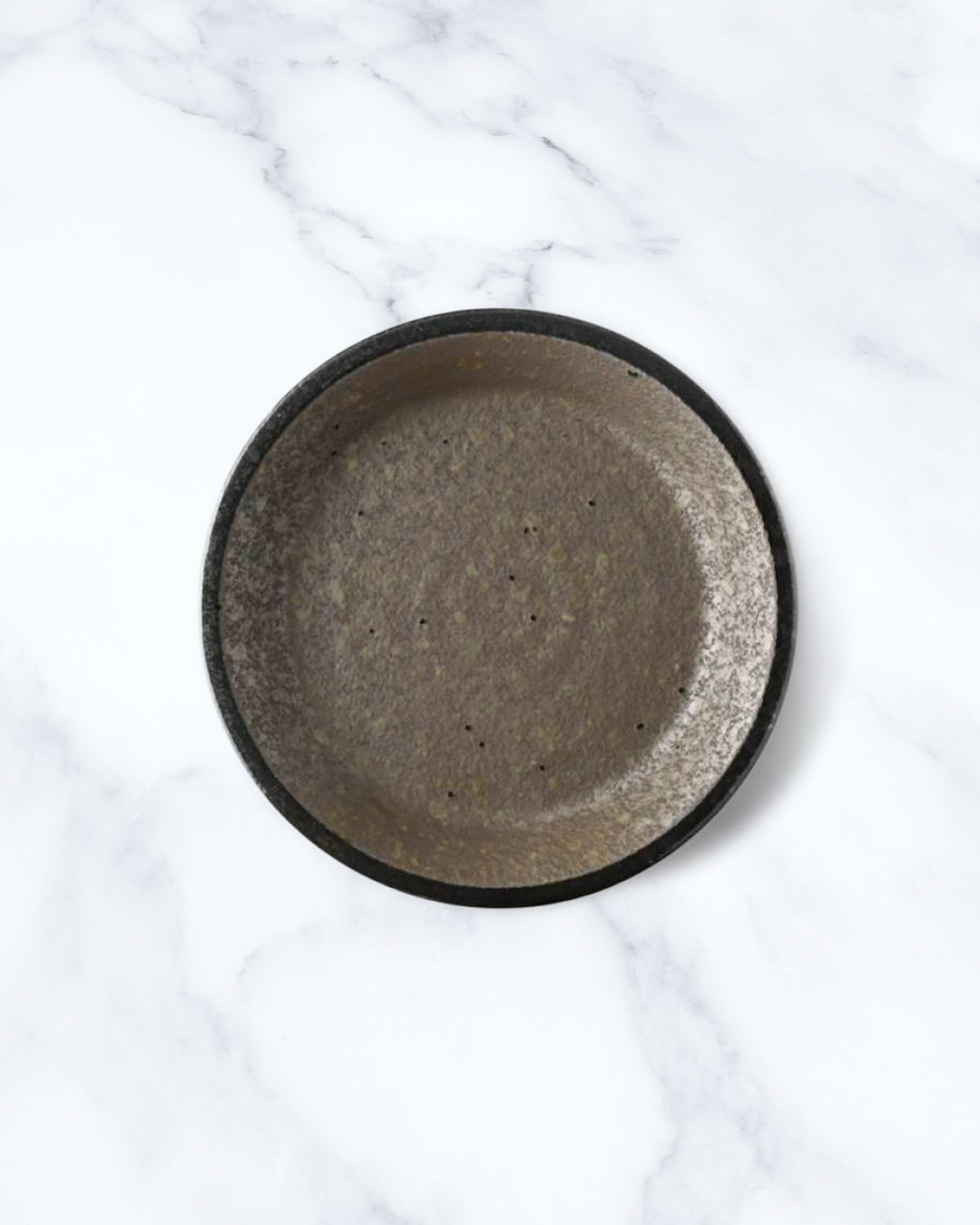 Rough textured serving plate with matt glaze in a dark brown shade that catches the light to reveal a silvery shimmer. Use for side dishes and snacks.