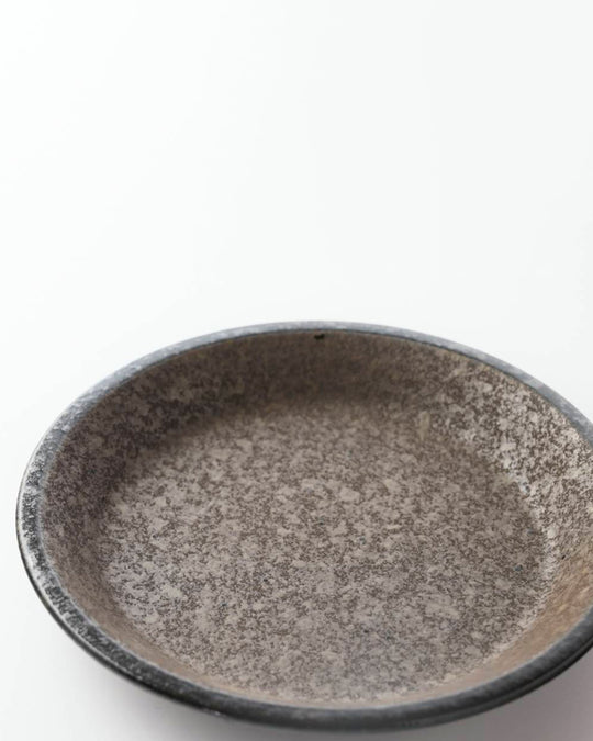 Rough textured serving plate with matt glaze in a dark brown shade that catches the light to reveal a silvery shimmer. Use for side dishes and snacks.