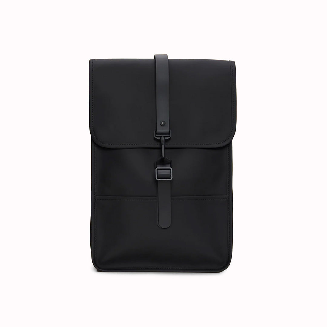 Black Mini Backpack. Made from Rains' signature water-resistant fabric with a matte finish, this minimalistic, modern rucksack is called 'Mini' but is the perfect size for daily use. It has an inside laptop pocket, a spacious main compartment and a hidden phone pocket on the backside.