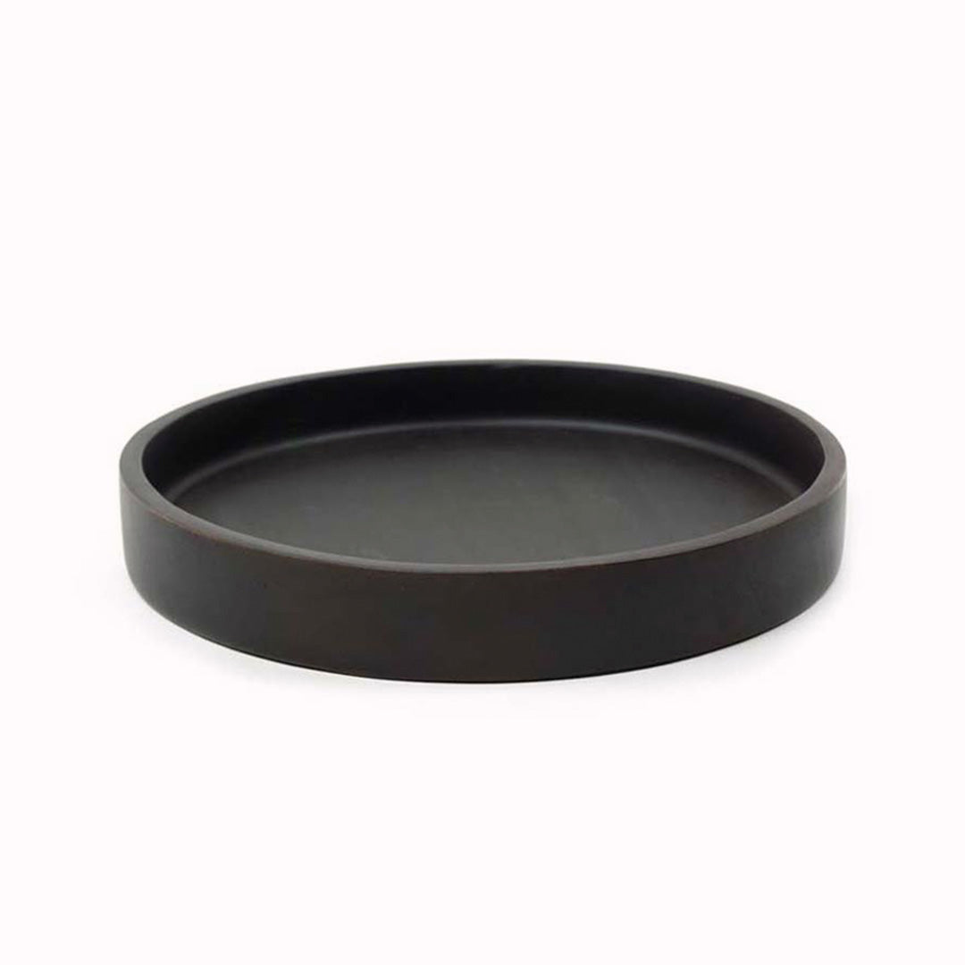 A black acacia wood tray from Dutch company Kinta, who produce contemporary ceramics and homeware. Round in shape with raised lip edge, the tray is 25cm diameter which will comfortably fit a teapot and a couple of mugs.
