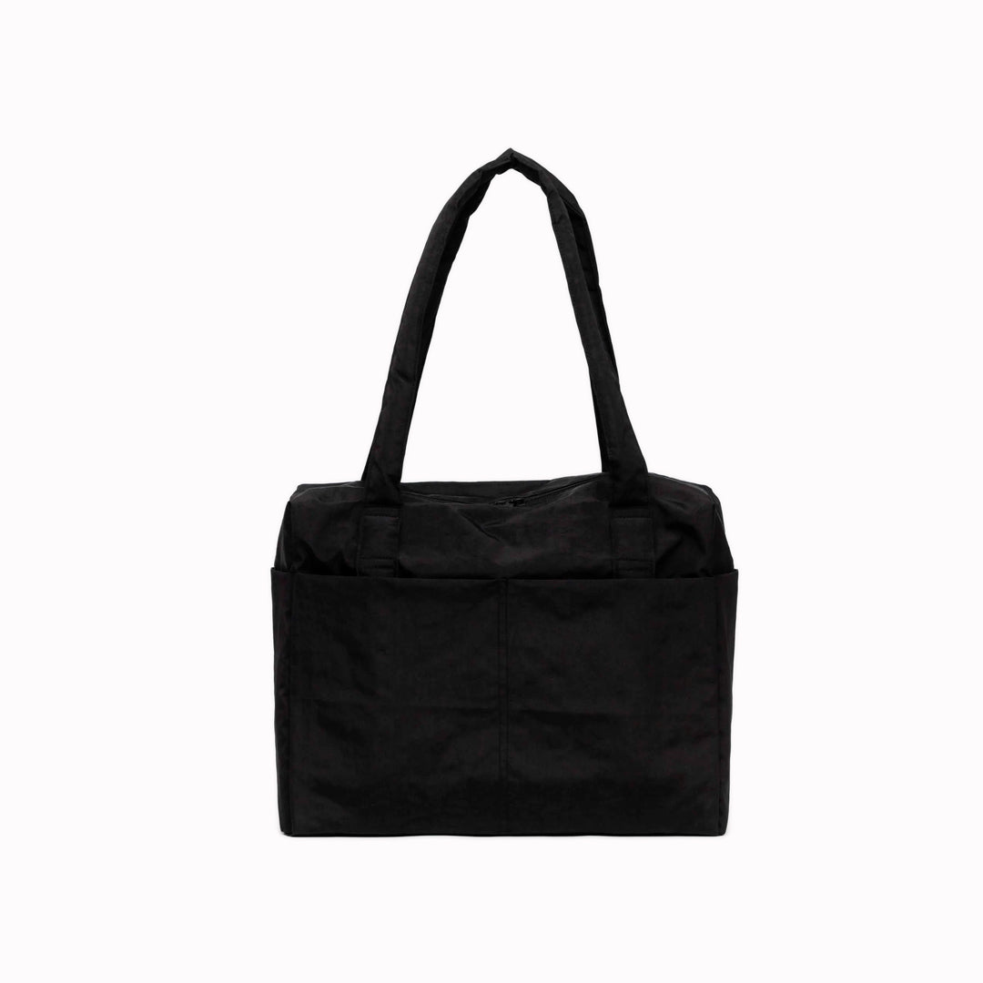 A compact carry-on built around movement. This scaled-down version of BAGGU’s Cloud series keeps the same soft structure, but tightens the proportions for under-seat travel and everyday carry.