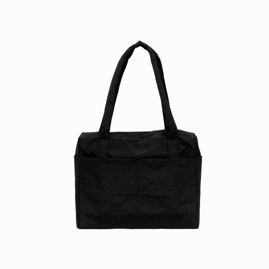 A compact carry-on built around movement. This scaled-down version of BAGGU’s Cloud series keeps the same soft structure, but tightens the proportions for under-seat travel and everyday carry.