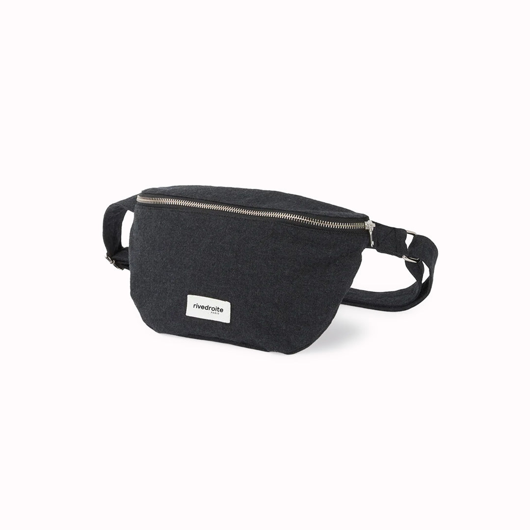 The Black Custine Belt Bag is a stylish and practical accessory crafted from upcycled denim. Designed by Rive Droite
