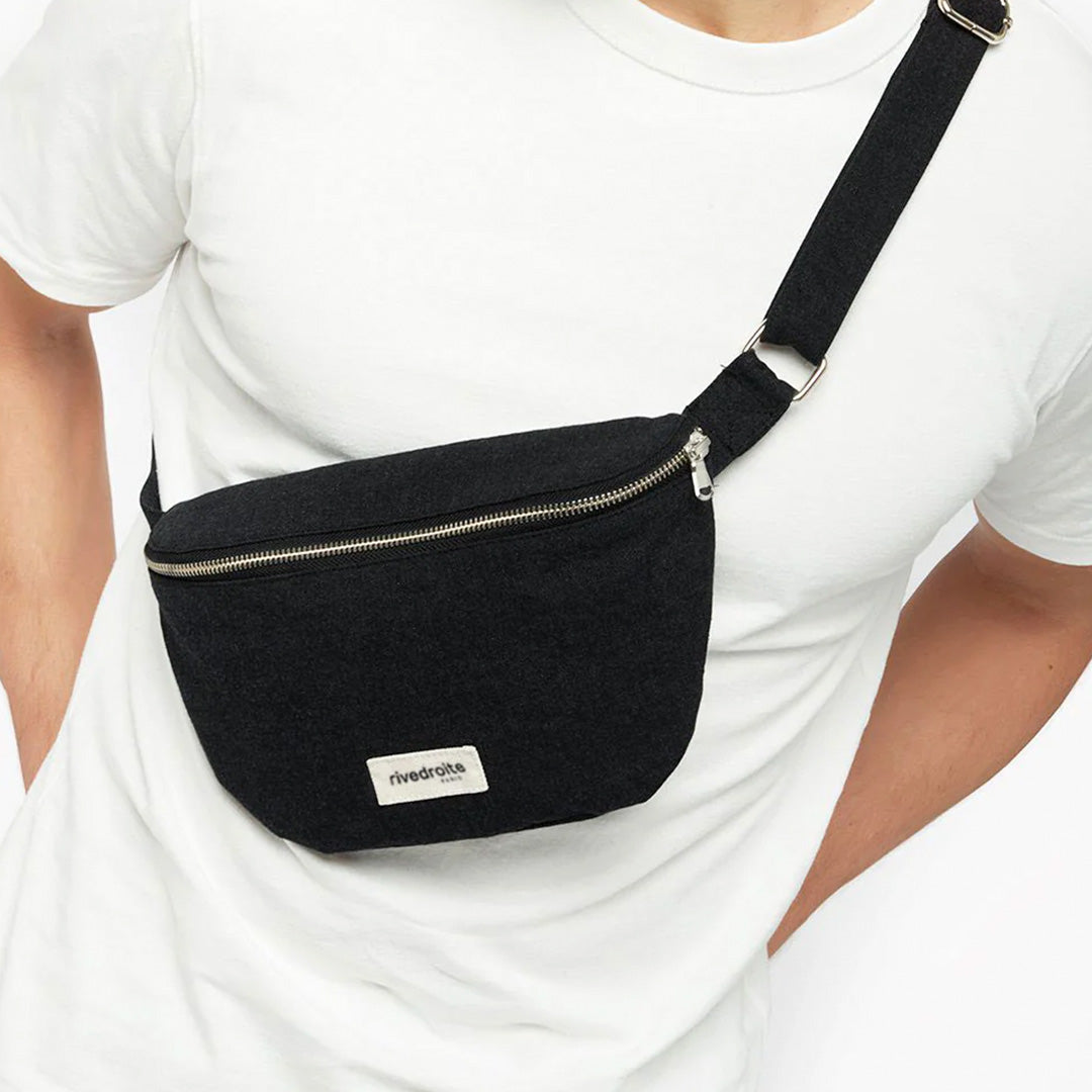 The Black Custine Belt Bag is a stylish and practical accessory crafted from upcycled denim. Designed by Rive Droite