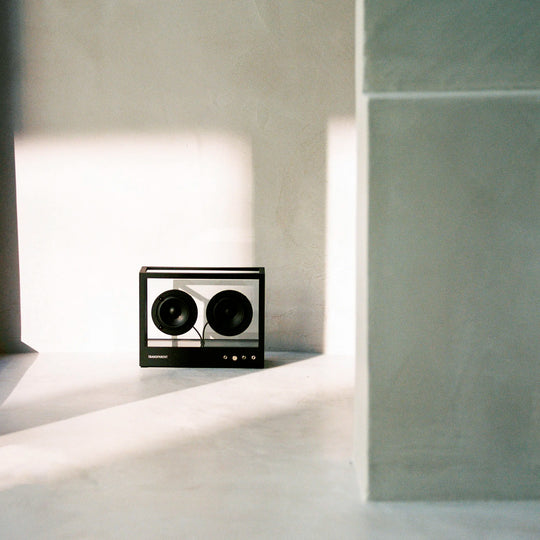 The Transparent Small Transparent Speaker in black is a compact Bluetooth speaker built with the same thinking as good furniture — minimal, functional and made to last.