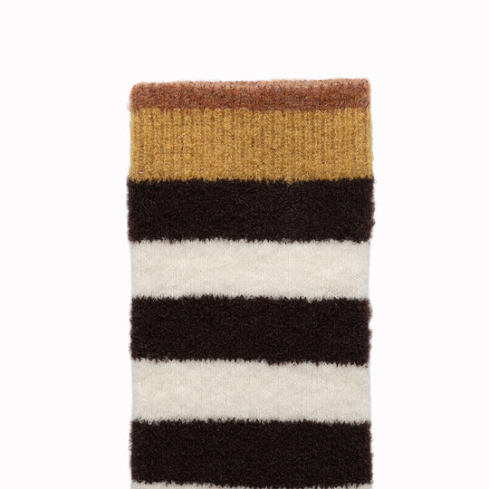 The French brand Bonne Maison creates high quality socks with Egyptian cotton and an elastane double thread. These fluffy mid-rise socks are machine washable at 30/40° C. The composition of these thin socks is : 62% wool, 37% polyamide, 1% elastane. This perfect mix offers to these fluffy socks warmth and comfort.