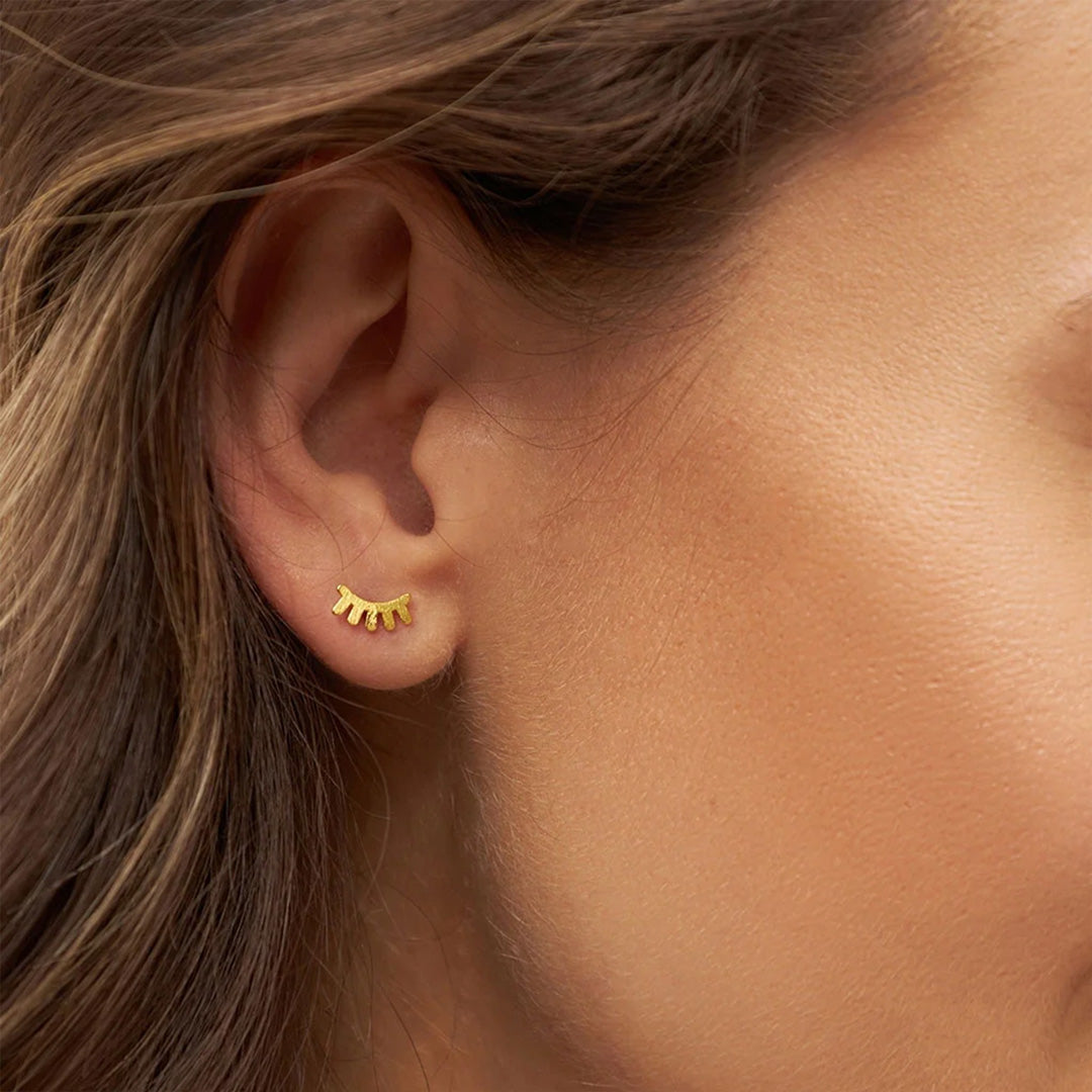 LULU Copenhagen's Blink earring captures all those signals in a simple and minimal design. As Worn Detail.