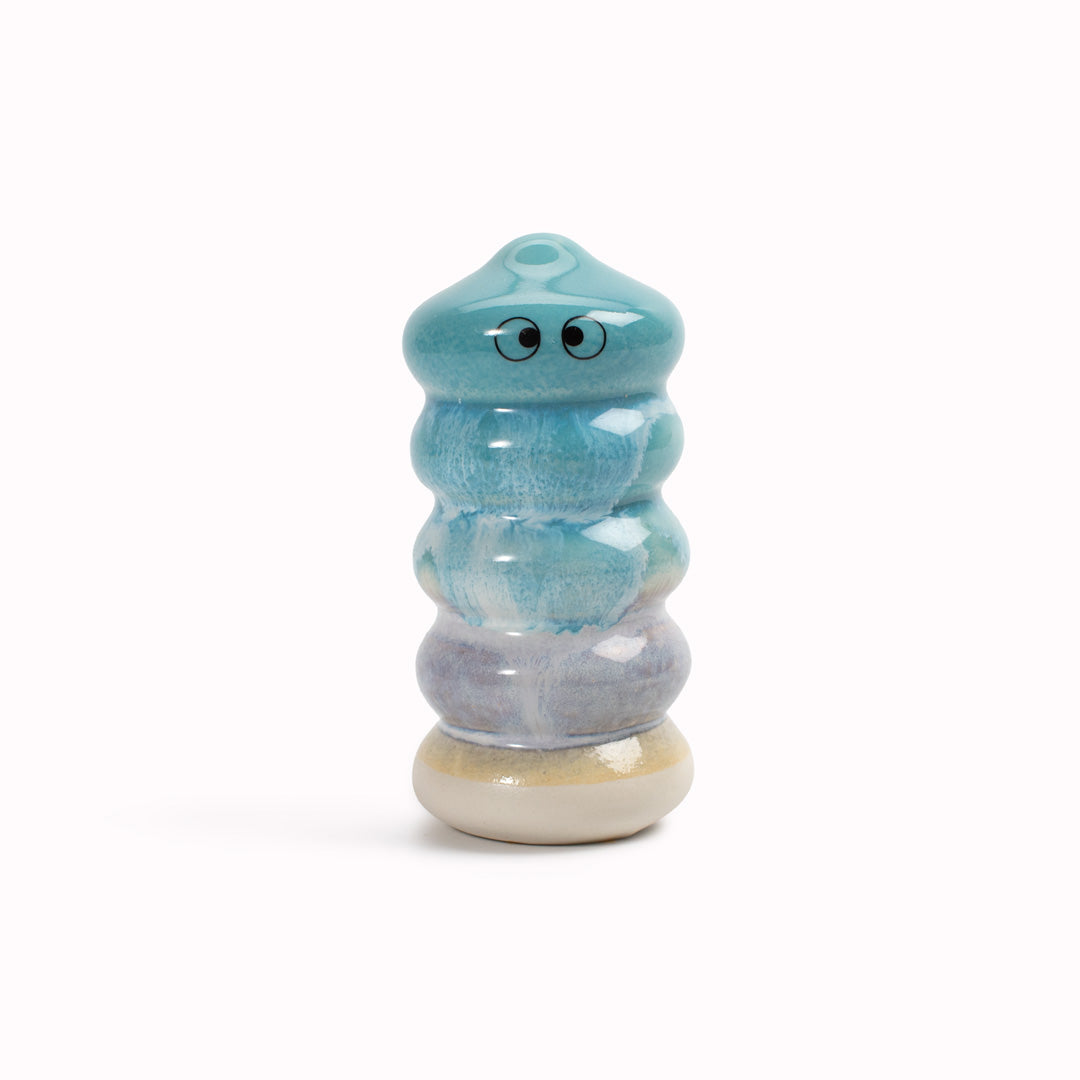 Meet Buru! Buru is a ridged cylinde shaped, hand glazed ceramic figurine created as a close relative of the classic Arhoj Ghost.