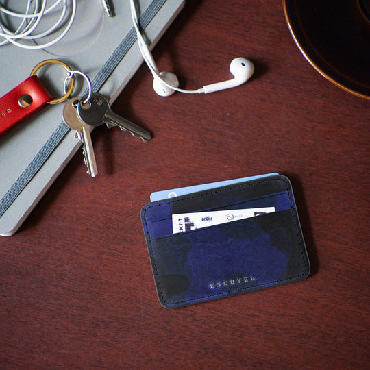 A slim and stylish cardholder from Escuyer, in Blue leather with Camouflage pattern. 