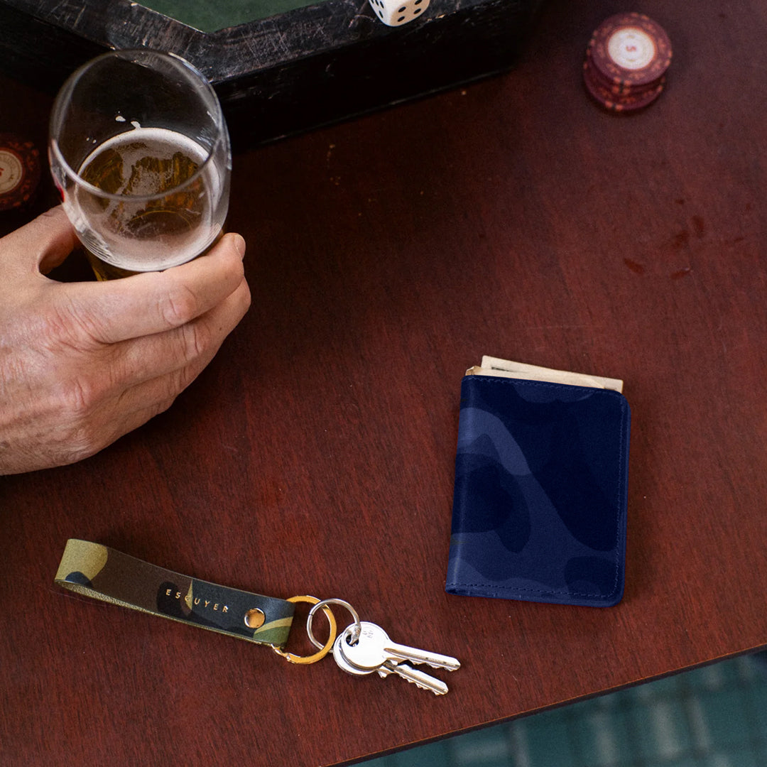 A slim leather wallet from Escuyer, in a Blue toned Camouflage effect pattern. Handmade by Portuguese artisans from leather sourced from a tannery in Tuscany, Italy.&nbsp;