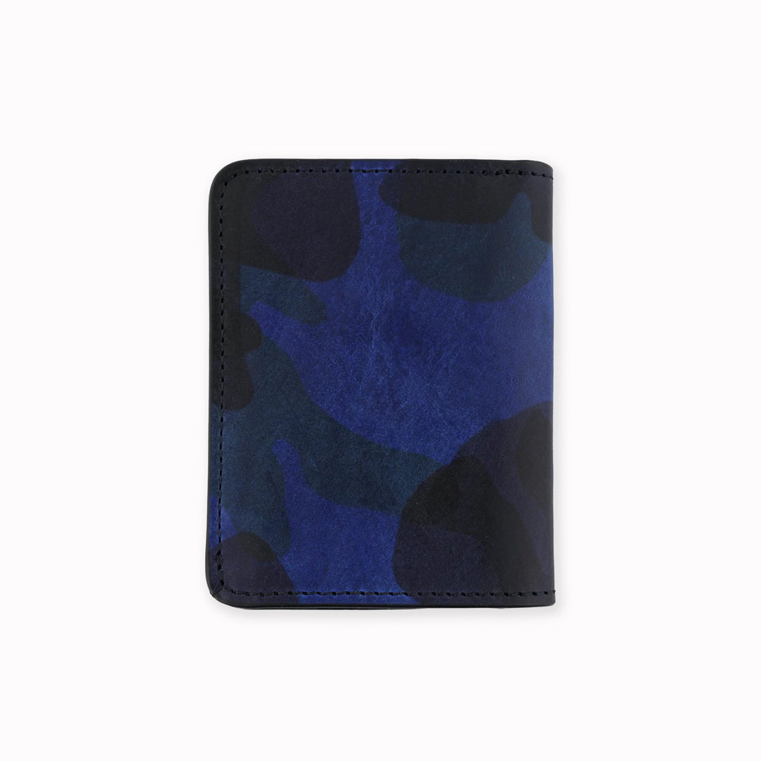 A slim leather wallet from Escuyer, in a Blue toned Camouflage effect pattern. Handmade by Portuguese artisans from leather sourced from a tannery in Tuscany, Italy.&nbsp;