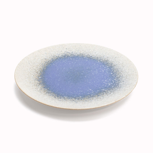 Blue Pool Serving Plate has a slightly matt edge and a glazed blue middle resembling a serene pool. It is ideal for serving salads, appetizers, desserts and more.