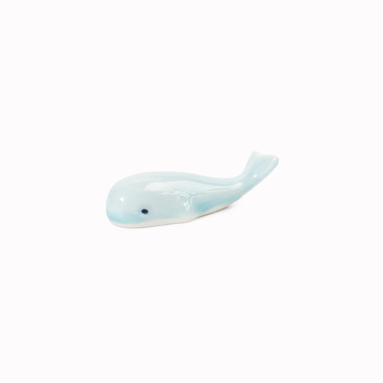 Celadon blue toned porcelain whale chopstick rest made from 'Minoyaki' porcelain, fired at a high temperature and hand finished in Gifu prefecture, Japan.
