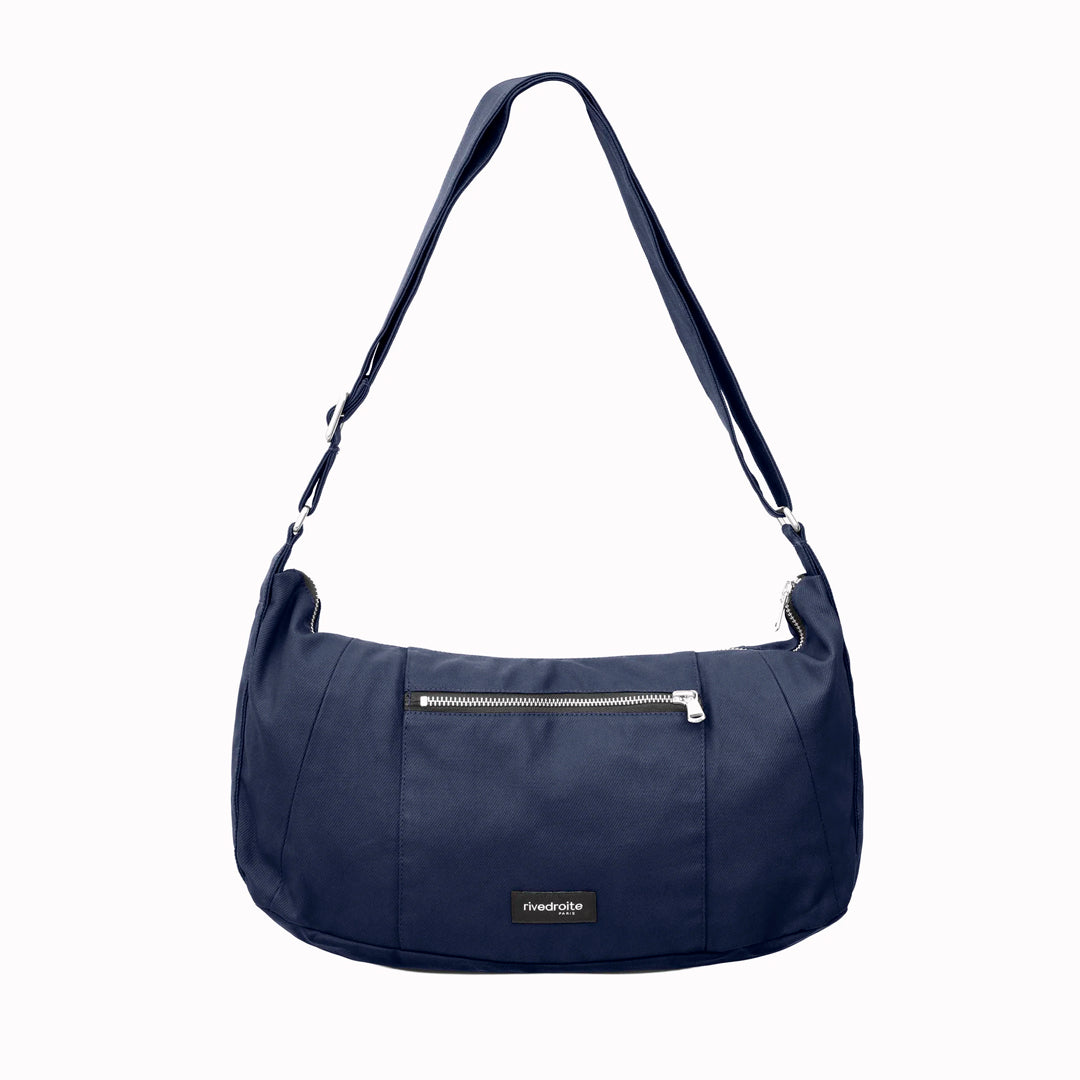 The Mini Charlot is a compact shoulder bag large enough for all your daily essentials. For AW26 the bag is made from a 100% organic cotton canvas fabric with a water resistant coating