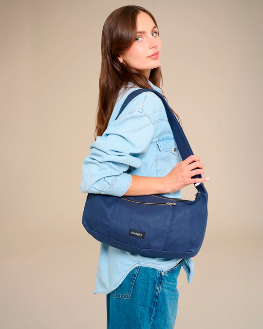 The Mini Charlot is a compact shoulder bag large enough for all your daily essentials. For AW26 the bag is made from a 100% organic cotton canvas fabric with a water resistant coating