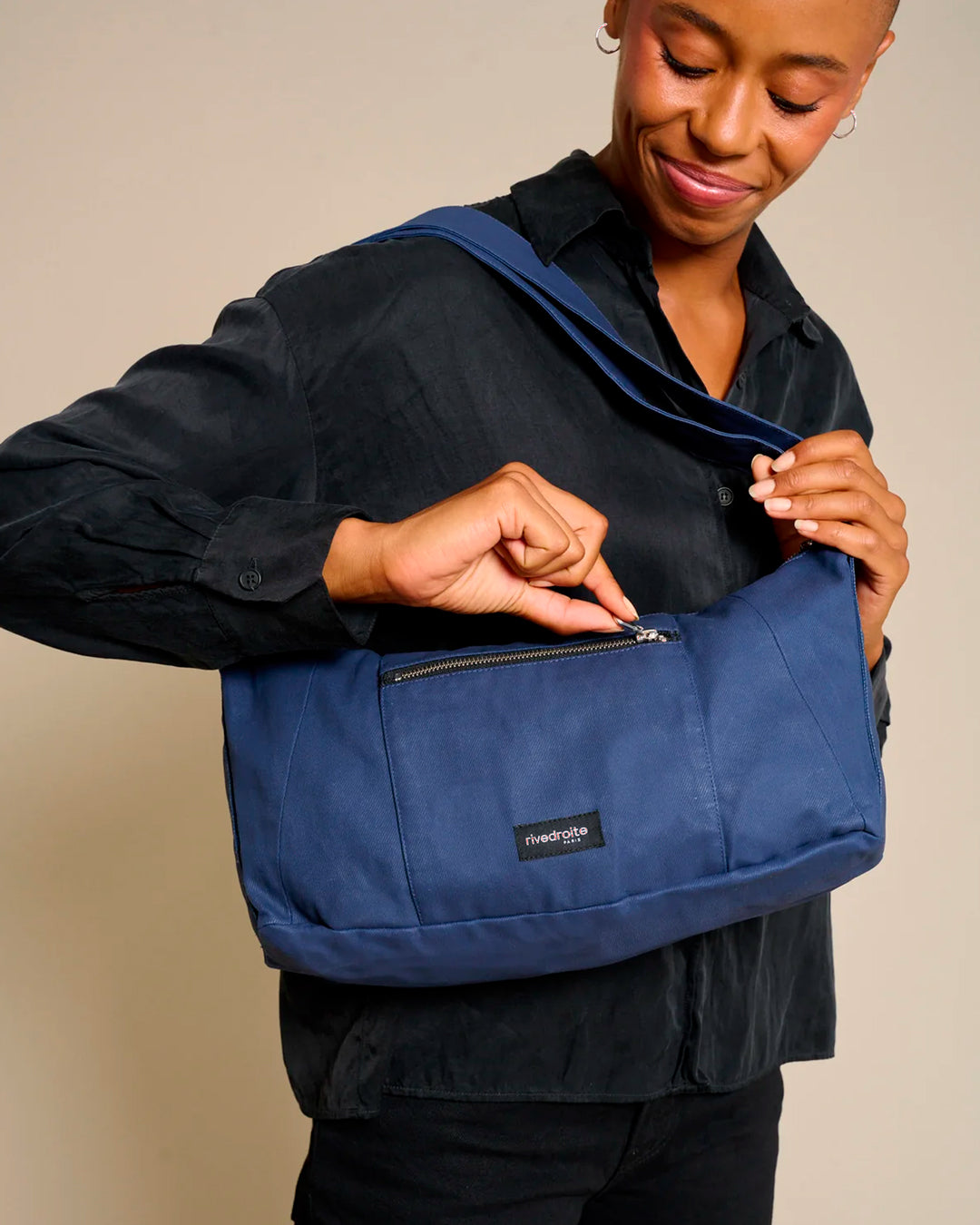 The Mini Charlot is a compact shoulder bag large enough for all your daily essentials. For AW26 the bag is made from a 100% organic cotton canvas fabric with a water resistant coating