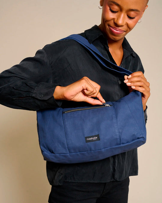 The Mini Charlot is a compact shoulder bag large enough for all your daily essentials. For AW26 the bag is made from a 100% organic cotton canvas fabric with a water resistant coating