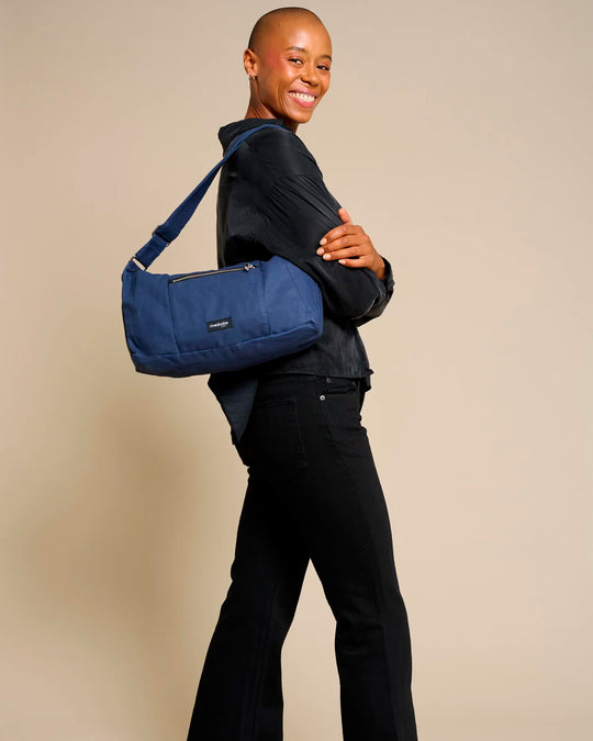 The Mini Charlot is a compact shoulder bag large enough for all your daily essentials. For AW26 the bag is made from a 100% organic cotton canvas fabric with a water resistant coating