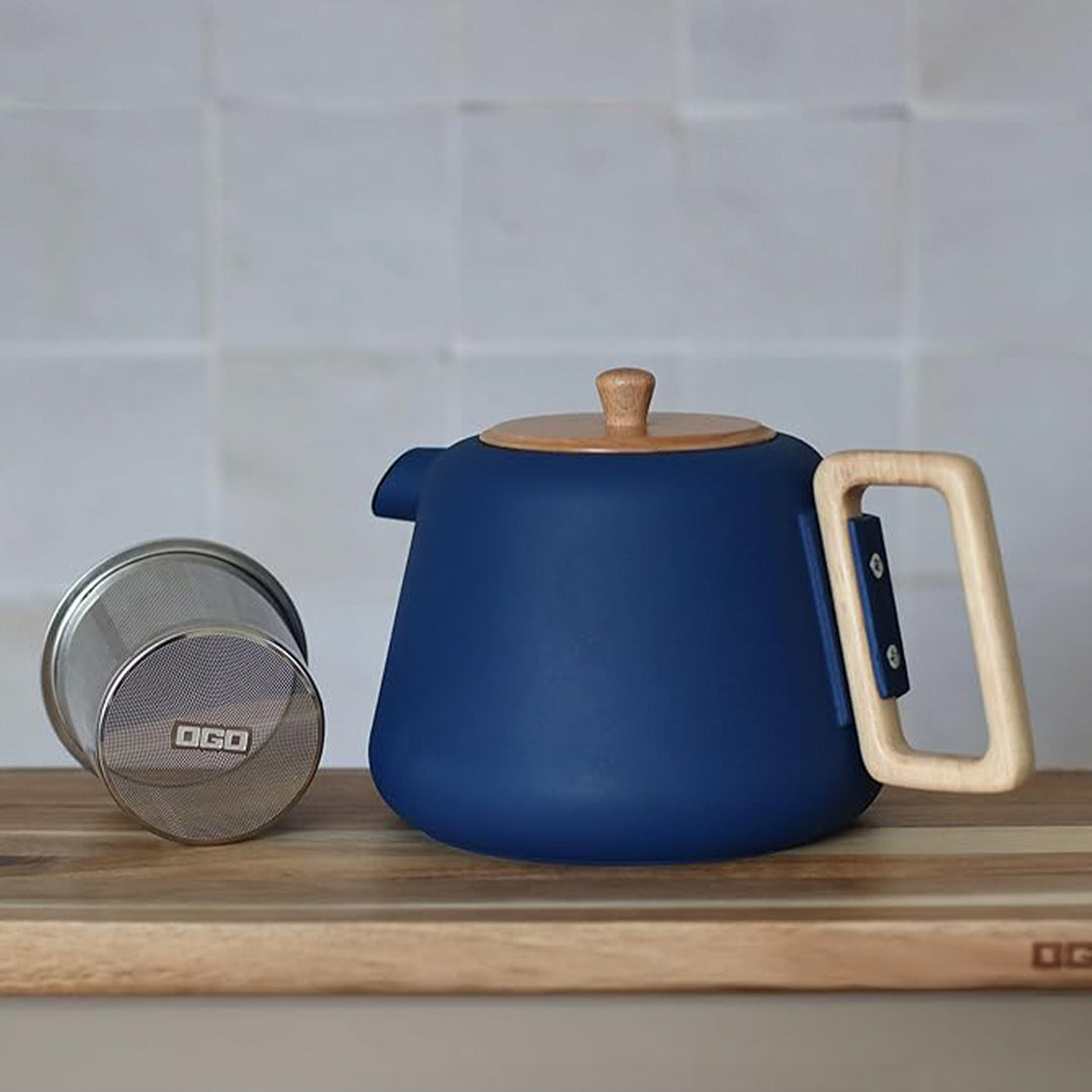 500ml cast iron tea pot with modern styling including almond green matte finish with a wooden handle and lid.