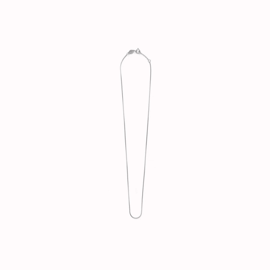 The Box Chain necklace from Anni Lu is a delicate chain necklace with a tight, square-link structure. 