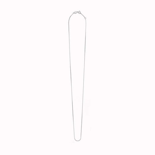 The Box Chain necklace from Anni Lu is a delicate chain necklace with a tight, square-link structure. 